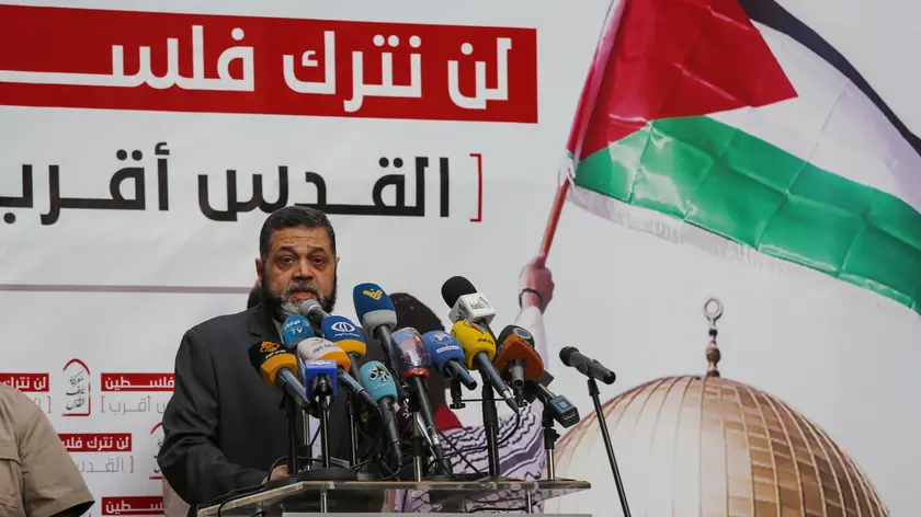 epa09207657 Representative of the Hamas movement, Osama Hamdan speaks to the supporters of Hezbollah and the Palestinian revolution factions during a rally in support of Palestinein the southern suburb of Beirut, Lebanon, 17 May 2021. In response to days of violent confrontations between Israeli security forces and Palestinians in Jerusalem, various Palestinian militants' factions in Gaza launched rocket attacks since 10 May that killed at least ten Israelis to date. According to the Palestinian Ministry of Health, at least 198 people including 58 children and 35 women have been killed and more than 1300 injured in the retaliatory Israeli airstrikes. EPA/NABIL MOUNZER