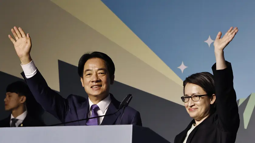 epa11073384 Taiwanese Vice President and ruling Democratic Progressive Party (DPP) presidential candidate William Lai Ching-te (C) and vice presidential candidate Hsiao Bi-khim wave after winning the presidential elections, during a press conference in Taipei, Taiwan, 13 January 2024. DPP's William Lai is set to be Taiwan's next president after his rivals conceded defeat in the Taiwan presidential elections. EPA/DANIEL CENG