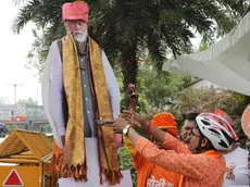 epa11388542 Bharatiya Janata Party (BJP) supporters celebrate their party's lead in the election results, with a cardboard cutout figure of Prime Minsiter Narendra Modi, at the BJP headquarters in New Delhi, India, 04 June 2024. Counting for the general election results has started for India's 545-member lower house of parliament, or Lok Sabha, with early trends showing the Bharatiya Janata Party and its National Democratic Alliance (NDA) leading. EPA/RAJAT GUPTA