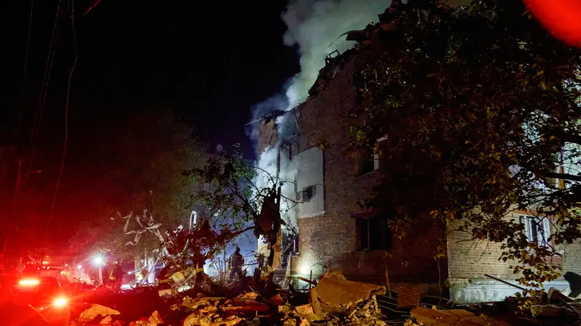 epa11381048 Ukrainian rescuers working at the site of the shelling of a residential building in Kharkiv, Ukraine, 31 May 2024 amid the Russian invasion. At least 5 people died and 25 were wounded in the overnight rocket attack on the residential area according to the report of the head of the Kharkiv Military Administration Oleg Synegubov. Russian troops entered Ukrainian territory on 24 February 2022, starting a conflict that has provoked destruction and a humanitarian crisis. EPA/SERGEY KOZLOV