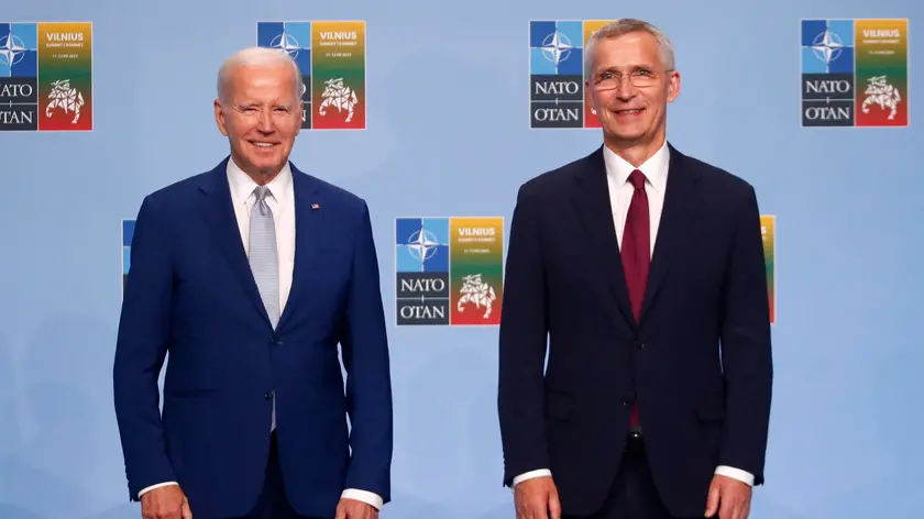 epa10739325 NATO Secretary General Jens Stoltenberg (R) greets US President Joe Biden at the NATO summit in Vilnius, Lithuania, 11 July 2023. The North Atlantic Treaty Organization (NATO) Summit will take place in Vilnius on 11 and 12 July 2023 with the alliance's leaders expected to adopt new defence plans. EPA/TOMS KALNINS
