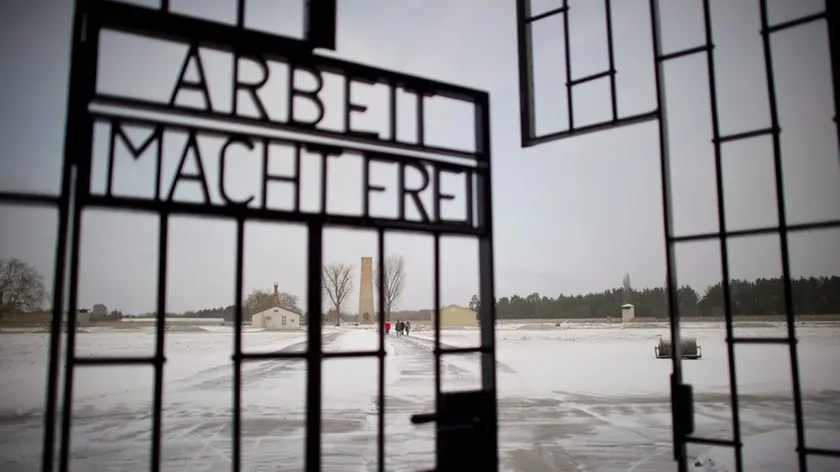 epa03097904 The lettering 'Arbeit macht frei', meaning work sets you free or work liberates, is visible at the entrance to the Memorial and Museum Sachsenhausen - the former concentration camp Sachsenhausen - in Oranienburg, Germany, 09 February 2012. The annual press conference of the Brandenburg Memorials Foundation took place on the same day. The highlights of the previous year, future construction works and upcoming events for 2012 were discussed at the press conference. EPA/PATRICK PLEUL