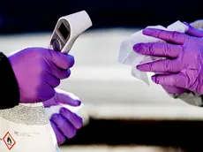 epa08293988 Polish border guard officers in protective suits hold thermometers during sanitary border controls at the German-Polish border in Goerlitz , Germany, 14 March 2020. Poland will ban foreigners from entering the country from 15 March 2020 and impose a 14-day quarantine on its citizens returning home in order to halt the wide spread of coronavirus, Prime Minister Prime Minister Mateusz Morawiecki said on 13 March 2020. Several European countries have closed borders, schools as well as public facilities, and have cancelled most major sports and entertainment events in order to prevent the spread of the SARS-CoV-2 coronavirus causing the Covid-19 disease. EPA/FILIP SINGER