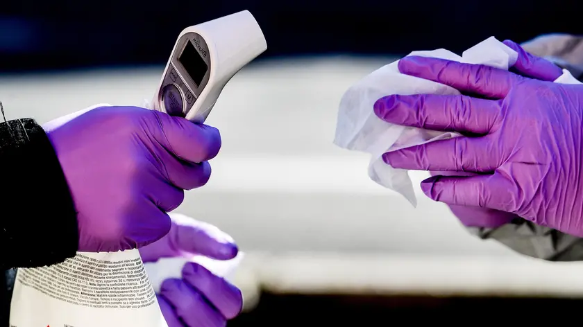 epa08293988 Polish border guard officers in protective suits hold thermometers during sanitary border controls at the German-Polish border in Goerlitz , Germany, 14 March 2020. Poland will ban foreigners from entering the country from 15 March 2020 and impose a 14-day quarantine on its citizens returning home in order to halt the wide spread of coronavirus, Prime Minister Prime Minister Mateusz Morawiecki said on 13 March 2020. Several European countries have closed borders, schools as well as public facilities, and have cancelled most major sports and entertainment events in order to prevent the spread of the SARS-CoV-2 coronavirus causing the Covid-19 disease. EPA/FILIP SINGER