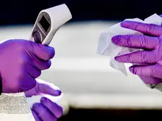 epa08293988 Polish border guard officers in protective suits hold thermometers during sanitary border controls at the German-Polish border in Goerlitz , Germany, 14 March 2020. Poland will ban foreigners from entering the country from 15 March 2020 and impose a 14-day quarantine on its citizens returning home in order to halt the wide spread of coronavirus, Prime Minister Prime Minister Mateusz Morawiecki said on 13 March 2020. Several European countries have closed borders, schools as well as public facilities, and have cancelled most major sports and entertainment events in order to prevent the spread of the SARS-CoV-2 coronavirus causing the Covid-19 disease. EPA/FILIP SINGER