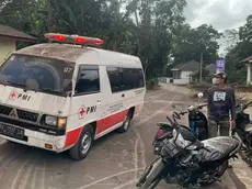 epa11010166 A handout photo made available by the Agam Regional Disaster Management Agency (BPBD) shows an ambulance in transit following the Mount Marapi eruption in Nagari Lasi, Agam, West Sumatra, Indonesia, 03 December 2023 (issued 04 December 2023). At least 11 hikers were found dead after the Marapi volcano erupted on 03 December 2023, according to the Indonesian rescue agency (BASARNAS). EPA/BPBD AGAM / HANDOUT HANDOUT EDITORIAL USE ONLY/NO SALES HANDOUT EDITORIAL USE ONLY/NO SALES