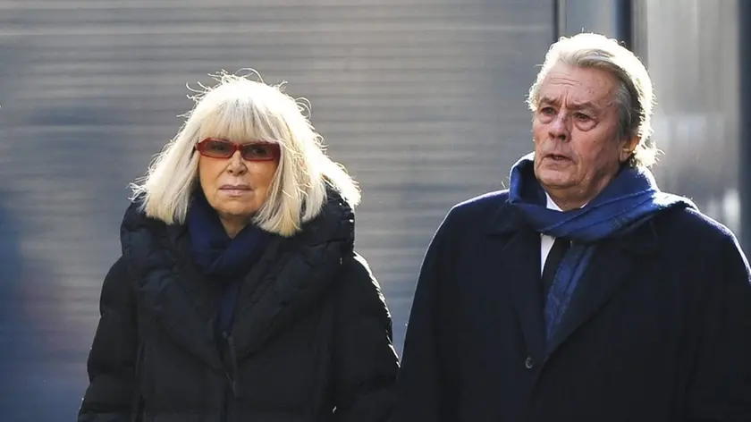 French actors Mireille Darc (L) and Alain Delon arrive at Saint Roch church for the funeral of French actress Annie Girardot in Paris, France, 04 March 2011. Girardot passed away at the age of 79 on 28 February 2011. EPA/CHRISTOPHE MORIN ***FRANCE OUT --- BELGIUM OUT*** EPA/CHRISTOPHE MORIN ***FRANCE OUT --- BELGIUM OUT***