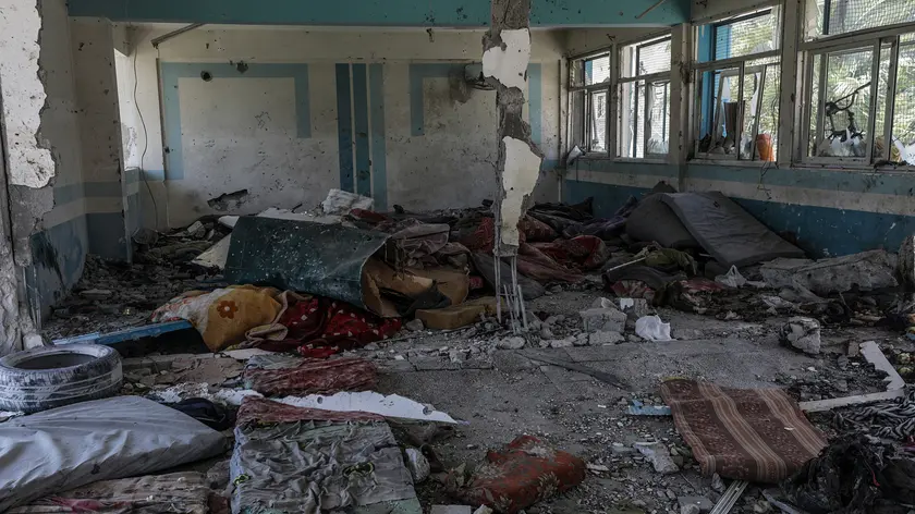 epa11392922 The destroyed UNRWA school following an Israeli air strike in Al Nusairat refugee camp in the central Gaza Strip, 06 June 2024. According to the Palestinian News Agency Wafa, at least 32 people were killed and dozens others were injured on early 06 June following an Israeli strike on a UNRWA school sheltering displaced Palestinians, located in the Nuseirat refugee camp in the central Gaza strip. The Israeli army said that it had "conducted a precise strike on a Hamas compound", whose members were " embedded in the UNRWA school". More than 36,000 Palestinians and over 1,400 Israelis have been killed, according to the Palestinian Health Ministry and the Israel Defense Forces (IDF), since Hamas militants launched an attack against Israel from the Gaza Strip on 07 October 2023, and the Israeli operations in Gaza and the West Bank which followed it. EPA/MOHAMMED SABER