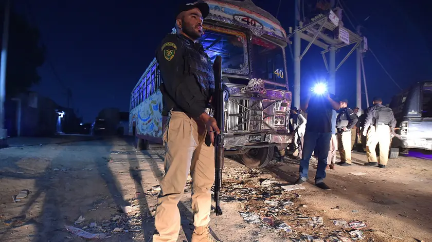 epa10969519 A Pakistani police official stands guard during a late night search operation after the Pakistani government's deadline to expel undocumented immigrants expired in Karachi, Pakistan, 11 November 2023. The deadline set by Pakistan's government for undocumented immigrants and refugees to leave the country voluntarily expired on 01 November 2023. Pakistani authorities started to crack down on irregular migration, which particularly affects millions of Afghan refugees who had fled their homeland, many of them driven by decades of armed conflict and the return to power of the Taliban. Since Pakistan announced the deadline, a huge migratory flow has been recorded on the porous border between Pakistan and Afghanistan. According to official data, about 4.4 million Afghans are living in the country, of which 1.7 million are not registered. EPA/SHAHZAIB AKBER