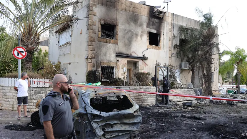 epa11618485 Israeli emergency teams inspect the damage at the scene of a missile strike on a residential neighbourhood in Kiryat Bialik, northern Israel, 22 September 2024. The Israeli military said that about 85 projectiles were identified crossing from Lebanon into several areas in northern Israel on 22 September. Some of the shells were intercepted, and fallen projectiles were located in Kiryat Bialik, Tsur Shalom and Moreshet, igniting fires in the area, the statement added. Following the attack on northern Israel the Israel Defense Forces (IDF) said it conducted strikes against Hezbollah targets in Lebanon. EPA/ABIR SULTAN
