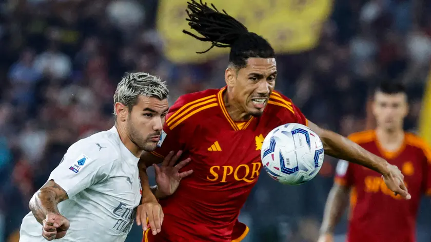 AS Roma's Chris Smalling (R) and AC Milan's Theo Hernandez during the Italian Serie A soccer match between AS Roma and AC Milan at the Olimpico stadium in Rome, Italy, 01 September 2023. ANSA/FABIO FRUSTACI
