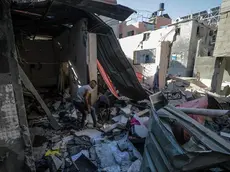 epa11435791 Palestinians inspect the destroyed home of Nasr family following an Israeli air strike in the Al-Maghazi refugee camp, southern Gaza Strip, 25 June 2024. According to a report from the Palestinian Ministry of Health, five Palestinians were killed and more than 12 injured overnight in an Israeli air strike on the Al-Maghazi refugee camp. More than 37,000 Palestinians and over 1,400 Israelis have been killed, according to the Palestinian Health Ministry and the Israel Defense Forces (IDF), since Hamas militants launched an attack against Israel from the Gaza Strip on 07 October 2023, and the Israeli operations in Gaza and the West Bank which followed it. EPA/MOHAMMED SABER