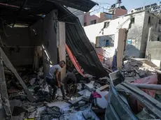 epa11435791 Palestinians inspect the destroyed home of Nasr family following an Israeli air strike in the Al-Maghazi refugee camp, southern Gaza Strip, 25 June 2024. According to a report from the Palestinian Ministry of Health, five Palestinians were killed and more than 12 injured overnight in an Israeli air strike on the Al-Maghazi refugee camp. More than 37,000 Palestinians and over 1,400 Israelis have been killed, according to the Palestinian Health Ministry and the Israel Defense Forces (IDF), since Hamas militants launched an attack against Israel from the Gaza Strip on 07 October 2023, and the Israeli operations in Gaza and the West Bank which followed it. EPA/MOHAMMED SABER