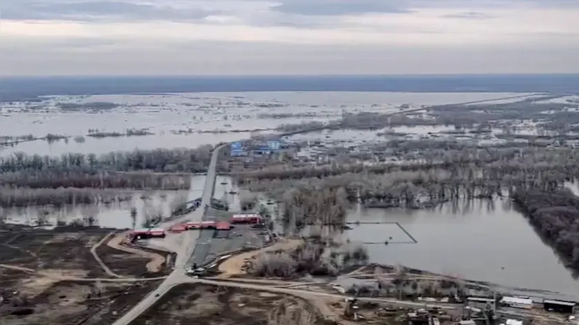 epa11267325 A handout photo taken from a video made available by the Russian Emergency Situations Ministry shows an aerial view of the flooded zone in Orsk, Orenburg region, Russia, 09 April 2024. A protective embankment dam, introduced in 2010, broke on 05 April in Orsk. According to the latest data, more than 2,000 people were evacuated and 16 temporary accommodation centers have been deployed in the city. Orsk Mayor Vasily Kozupitsa reported on his Telegram channel that the water level in the Urals dropped by 39 cm in one day. EPA/RUSSIAN EMERGENCIES MINISTRY HANDOUT - BEST QUALITY AVAILABLE - HANDOUT EDITORIAL USE ONLY/NO SALES HANDOUT EDITORIAL USE ONLY/NO SALES