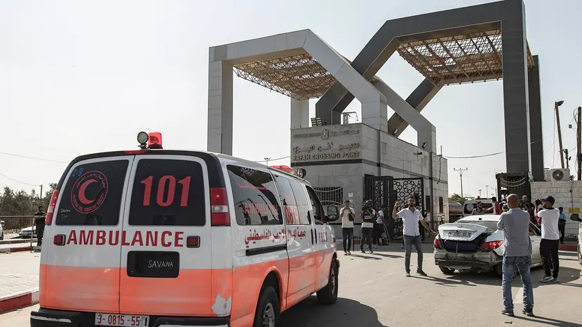 epa10952618 An ambulance with wounded Palestinians arrives at the Rafah border crossing between the Gaza Strip and Egypt, in Gaza, 01 November 2023. Ambulances carrying evacuees from the Gaza Strip were driven through the border crossing at Rafah on 01 November. As per the agreement made by Egypt, Israel, and Hamas, a number of foreign nationals and individuals with critical injuries will be permitted to evacuate the besieged territory. More than 8,500 Palestinians and at least 1,400 Israelis have been killed, according to the Israel Defense Forces (IDF) and the Palestinian health authority, since Hamas militants launched an attack against Israel from the Gaza Strip on 07 October, and the Israeli operations in Gaza and the West Bank which followed it. EPA/HAITHAM IMAD