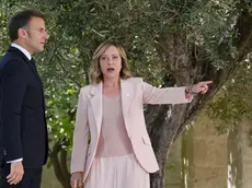 epa11407581 Italy's Prime Minister Giorgia Meloni (R) greets French President Emmanuel Macron (L) during a welcome ceremony for the G7 summit in Borgo Egnazia, southern Italy, 13 June 2024. The 50th G7 summit will bring together the Group of Seven member states leaders in Borgo Egnazia resort in southern Italy from 13 to 15 June 2024. EPA/ETTORE FERRARI