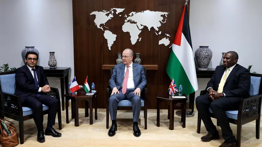 epa11551539 Palestinian Prime Minister Mohammed Mustafa C) attends a meeting with British Foreign Secretary David Lammy (R) and French Foreign Minister Stephane Sejourne (L) during their visit to the West Bank city of Ramallah, 16 August 2024. As Gaza ceasefire talks in presence of mediators from Qatar, Egypt and the US enter their second day, British Foreign Secretary David Lammy and his French counterpart Stephane Sejourne went on 16 August on a joint visit to Israel and to the West Bank. Their visit comes in an effort to push for a ceasefire in Gaza and de-escalation of conflict risks in the region, in the context of an expected Iranian retaliation on Israel after the killing of Hamas leader Ismail Haniyeh in Tehran on 31 July 2024. EPA/SHADI HATEM
