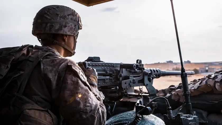 epa07964573 A handout photo made available by the US Department of Defense shows a US Marine attached to the Special Purpose Marine Air-Ground Task Force - Crisis Response - Central Command manning a M2 .50 caliber heavy machinegun at an undisclosed location in Syria, 16 October 2019 (issued 01 November 2019). Media reports state that the US military forces have returned to eastern Syria to protect oil fields, days after US President Trump ordered the complete withdrawal of American troops from the area. EPA/BRANDEN BOURQUE / US MARINE COPRS / DEPARTMENT OF DEFENSE HANDOUT EDITORIAL USE ONLY/NO SALES