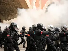 epa11312566 Police officers from the BRAV-M (Brigade of Repression of Motorized Violent Action) clash with protesters during the annual May Day march in Paris, France, 01 May 2024. Unions in France are demanding improved living conditions, higher wages, the defense of public services and a just and lasting peace. EPA/Teresa Suarez