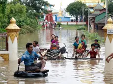 epa11603217 Flood victims wade through the flood with makeshift rafts in Taungoo, Bago division, Myanmar, 14 September 2024. Heavy rains triggered by Typhoon Yagi have caused severe flooding in parts of Myanmar, leaving thousands stranded in their homes, with further heavy rainfall and thunderstorms expected, according to the state weather office. A statement from the Military announced 59,413 households were affected in 34 townships and set up 187 relief camps for the 236,649 people. There were 33 casualties due to the flood in the country including the Naypyitaw. EPA/NYEIN CHAN NAING
