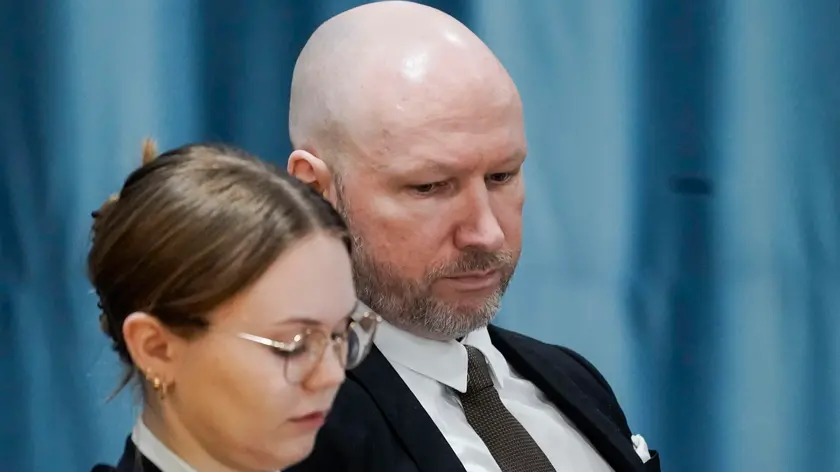 epa11064134 Anders Behring Breivik (R) sits next to attorney Marte Lindholm during the first day of the case of the Oslo district court concerning his sentencing conditions and his rights under the European Convention, at Ringerike prison near Tyristrand, Norway, 08 January 2024. Breivik, who now calls himself Fjotolf Hansen, was sentenced to 21 years in prison with a minimum term of 10 years for the terrorist attacks against Oslo and Utoya on 22 July 2011 in which 77 people lost their lives. EPA/CORNELIUS POPPE NORWAY OUT