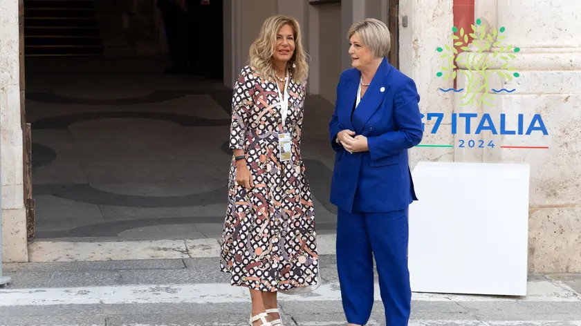 epa11599668 Italian Minister of Labor and Social Policies, Marina Calderone (R), welcomes B7 Italy 2024 Chair and CEO of Marcegaglia, Emma Marcegaglia (L), during the arrival of the delegations for the G7 ministersâ€™ meeting on Labour and Employment at the entrance of the Palazzo Regio in Cagliari, Italy, 12 September 2024. The G7 Ministersâ€™ Meeting on Labour and Employment will be held in Cagliari on 11-13 September. EPA/FABIO MURRU