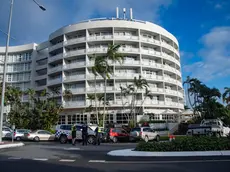 epa11546230 Emergency service works are seen at the Double Tree by Hilton Hotel after a helicopter crashed into its roof, in Cairns, Australia 12 August 2024. Police have declared a Public Safety Preservation Act in Cairns after the chopper crashed into the building shortly before 2am on Monday, August 12. EPA/BRIAN CASSEY AUSTRALIA AND NEW ZEALAND OUT