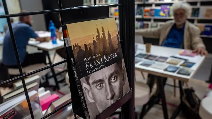 epa11370586 A book about Franz Kafka is displayed at Book World Prague 2024 fair, in Prague, Czech Republic, 24 May 2024 (issued 25 May 2024). Franz Kafka was Czech born famous German-language writer and 03 June 2024 will be the centenary of his death. A number of events and projects with Kafkaesque themes are planned to mark the anniversary. EPA/MARTIN DIVISEk