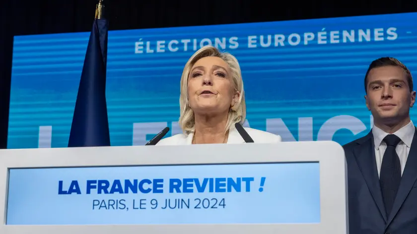 epa11401161 National Rally parliamentary party leader Marine Le Pen delivers a speech standing next to RN president Jordan Bardella (R) at the electoral party of the French right-wing party National Rally (Rassemblement National or RN) in Paris, France, 09 June 2024, after the first results of the European Elections. The list of the Rassemblement National, led by party chief Jordan Bardella, is given winner in France according to first estimations after polls. EPA/ANDRE PAIN