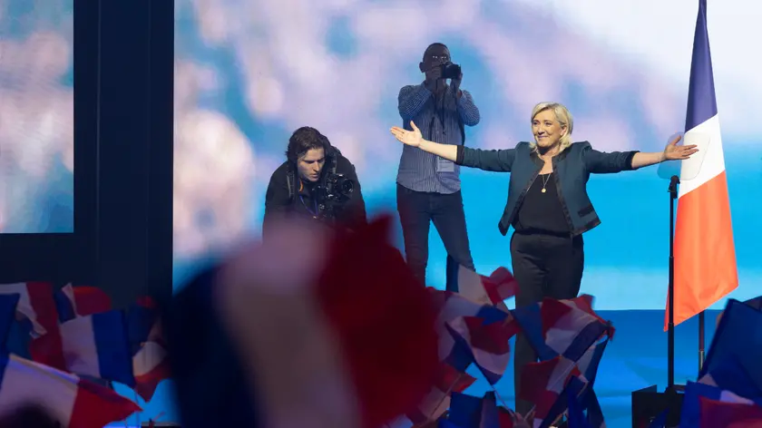 epa11385991 Marine Le Pen leader of the French far-right National Rally party (RN-Rassemblement National in French) greets the audience after delivering a speech for European election campaign in Paris, France, 02 June 2024. Elections for the European Parliament are due to take place between 06 and 09 June 2024. EPA/ANDRE PAIN