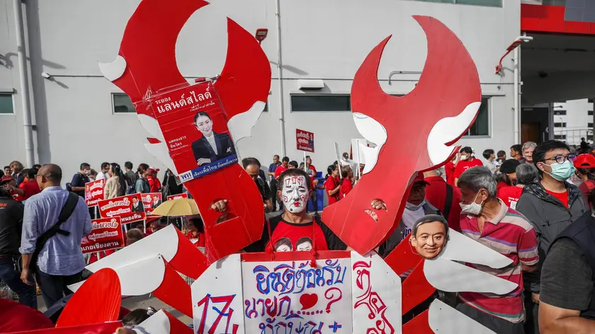 epa10812876 Supporters gather ahead of the arrival of the coup-ousted former Thai prime minister Thaksin Shinawatra at Don Mueang airport in Bangkok, Thailand, 22 August 2023. Shinawatra returns to Thailand after living in self-imposed exile for 15 years, following his overthrowing by a military coup on 19 September 2006. The former prime minister is expected to face imprisonment with a combined jail term of five years. EPA/RUNGROJ YONGRIT