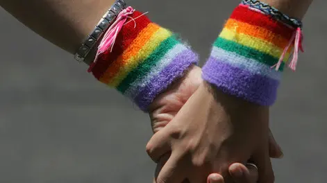 TEL AVIV, ISRAEL - JUNE 8: A lesbian couple hold hands during the annual Gay Pride rally, on June 8, 2007 Tel Aviv, Israel's most cosmopolitan city. Thousands of alternative lifestyle Israelis took advantage of the mild summer weather to celebrate sexual freedom amidst calls from Jewish, Muslim and Christian religious leaders to ban a similar rally in Jerusalem later this month. (Photo by David Silverman/Getty Images)