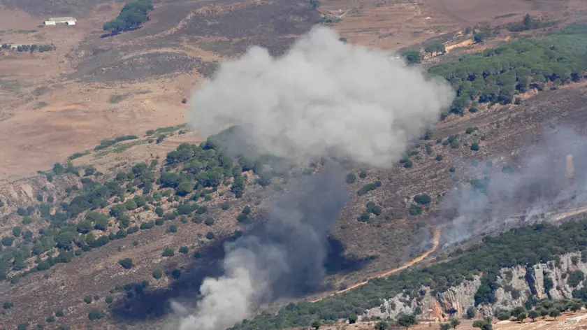 epa11621933 Smoke billows from the site of an Israeli airstrike that targeted Lebanese villages, as seen from Marjaayoun, southern Lebanon, 24 September 2024. Thousands of people fled southern Lebanon after an evacuation warning by the Israeli army, which on 23 September announced that it had launched 'extensive' airstrikes on Hezbollah targets in the country. According to Lebanon's Ministry of Health, at least 492 people have been killed and more than 1,645 have been injured following continued airstrikes on southern Lebanese towns and villages. EPA/STR