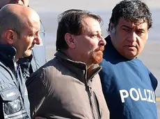 Former far-left militant Cesare Battisti arrives escorted by Italian police at Rome's Ciampino airport, Italy, 14 January 2019. Cesare Battisti, 64, a former member of the far-left terrorist group Armed Proletarians for Communism (PAC), was arrested in Bolivia after 38-years as a fugitive of the Italian justice. He is set to serve a life sentence for four murders committed in Italy's 'years of lead' of political violence in the 1970s and 1980s, media reported. ANSA/ETTORE FERRARI..