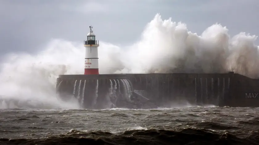 epa10954301 Waves crash against the harbour wall of Newhaven lighthouse in Newhaven, Britain, 02 November 2023. The UK Met Office has issued weather warnings as Storm Ciaran hits Britain with winds of ups to ninety mile an hour. EPA/ANDY RAIN