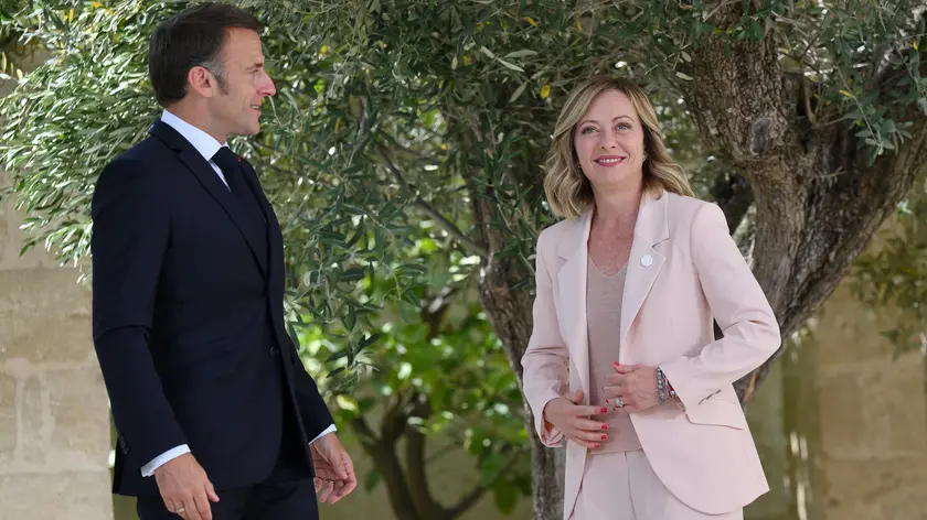 French President Emmanuel Macron (L) during the welcome ceremony with Italy's Prime Minister Giorgia Meloni (R), during the G7 Borgo Egnazia Summit in Borgo Egnazia (Brindisi), southern Italy, 13 June 2024. The G7 Borgo Egnazia Summit will be held from 13 to 15 June 2024. ANSA/ETTORE FERRARI
