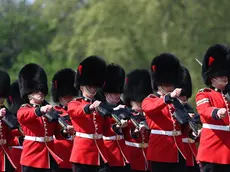 epa09906852 The Grenadier Guards perform the Changing of the Guard outside Buckingham Palace in London, Britain, 24 April 2022. The Changing of the Guard is a traditional military ceremony carried out daily where a group of soldiers who protect Buckingham Palace are replaced by a new group of soldiers. The Grenadier guards have protected British Kings and Queens at various royal palaces since 1656. EPA/ANDY RAIN