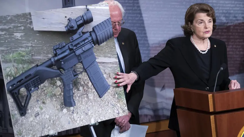 epa06625918 (FILE) - US Senator from California Diane Feinstein (C), with Democratic Senators Bernie Sanders (L) and Richard Blumenthal (R), delivers remarks on gun control legislation with a picture showing a so-called bump-stock, a device that simulates automatic gun fire, during a press conference in the US Capitol in Washington, DC, USA, 04 October 2017 (reissued 24 March 2018). US President Trump on 24 March 2018 announced to push for a ban of bump fire stocks. EPA/SHAWN THEW *** Local Caption *** 53809634