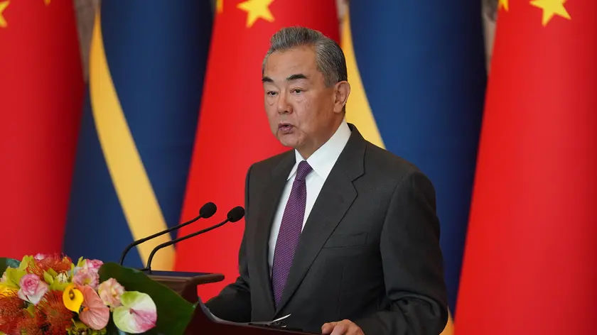 epa11100152 Chinese Foreign Minister Wang Yi gives a speech after signing the Joint Communiqué on the Resumption of Diplomatic Relations between the People's Republic of China and the Republic of Nauru, at Diaoyutai State Guesthouse in Beijing, China, 24 January 2024. EPA/Andrea Verdelli / POOL