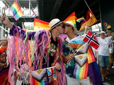 epa11383445 A foreign gay couple kiss during the LGBTQ+ parade to mark the Pride Month celebrations in Bangkok, Thailand, 01 June 2024. Thousands of Thai and international LGBTQIA+ participants take part in the annual Bangkok Pride parade to mark Pride Month under the 'Celebration of Love' concept to promote diversity and equal rights for all members of society as well as to celebrate the legalization of the Marriage Equality Act after Thai lawmakers passed the bill to legalize same-sex marriage, which makes Thailand to be the first Southeast Asia country to legalize same-sex marriage. The pride month is celebrated across the world annually in June to commemorate the 1969 Stonewall uprising to raise awareness and promote sexual diversity and equal rights for the Lesbian, Gay, Bisexual, Transgender, and Queer (LGBTQ) community. EPA/RUNGROJ YONGRIT