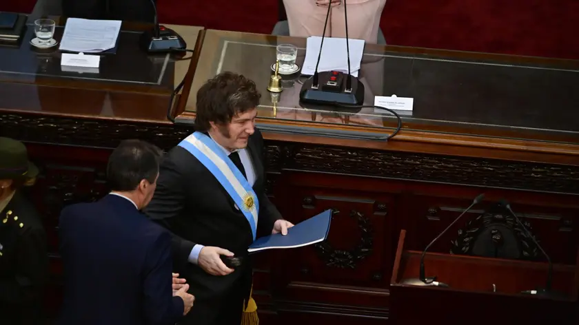 epa11192601 President Javier Milei (C) arrives to inaugurate the ordinary sessions in the Chamber of Deputies, in Buenos Aires, Argentina, 01 March 2024. Milei denounced that populism stole a good part of the population's income when reviewing the "inheritance" received from the administration of Peronist Alberto Fernandez (2019-2023). EPA/Matias Martin Campaya