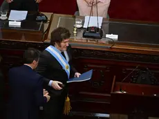 epa11192601 President Javier Milei (C) arrives to inaugurate the ordinary sessions in the Chamber of Deputies, in Buenos Aires, Argentina, 01 March 2024. Milei denounced that populism stole a good part of the population's income when reviewing the "inheritance" received from the administration of Peronist Alberto Fernandez (2019-2023). EPA/Matias Martin Campaya