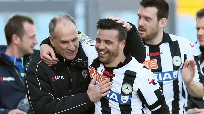 Udinese's Antonio Di Natale, center, celebrates with coach Francesco Guidolin, left, after scoring during the Serie A soccer match between Udinese and Chievo, at the Friuli Stadium in Udine, Italy, Sunday, April 07, 2013. (AP Photo/Paolo Giovannini)