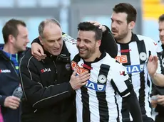 Udinese's Antonio Di Natale, center, celebrates with coach Francesco Guidolin, left, after scoring during the Serie A soccer match between Udinese and Chievo, at the Friuli Stadium in Udine, Italy, Sunday, April 07, 2013. (AP Photo/Paolo Giovannini)