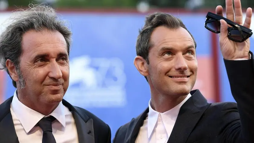 British actor Jude Law (R) and Italian director Paolo Sorrentino (L) arrive for the premiere of 'The Young Pope' during the 73rd Venice Film Festival in Venice, Italy, 03 September 2016. The movie is presented in Out competition at the festival running from 31 August to 10 September. ANSA/CLAUDIO ONORATI