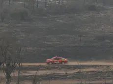 epa11603137 A fire truck travels through an area affected by a fire in the Chaco region in Bahia Negra, Paraguay, 13 September 2024. Under temperatures close to 45 degrees Celsius, more than 300 people, including volunteer firefighters, military personnel, officials, and farmers, are trying to extinguish the fire from both the ground and air. The blaze has devastated approximately 190,000 hectares in a vast area of the Paraguayan Chaco region (west), which borders Bolivia. EPA/JUAN PABLO PINO