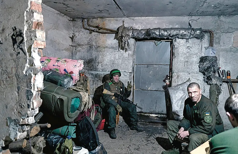 Ukrainian soldiers rest in a shelter in Bakhmut, Donetsk region, Ukraine, Tuesday, Feb. 21, 2023. (AP Photo/Libkos)