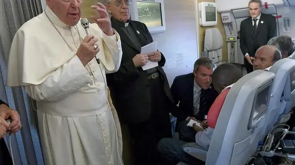 Pope Francis speaks to journalists aboard the flight from Bangui to Rome, 30 November 2015. Pope Francis ended a six days visit that took him to Kenya, Uganda and the Central African Republic from 25 to 30 November. ANSA/DANIEL DAL ZENNARO/POOL