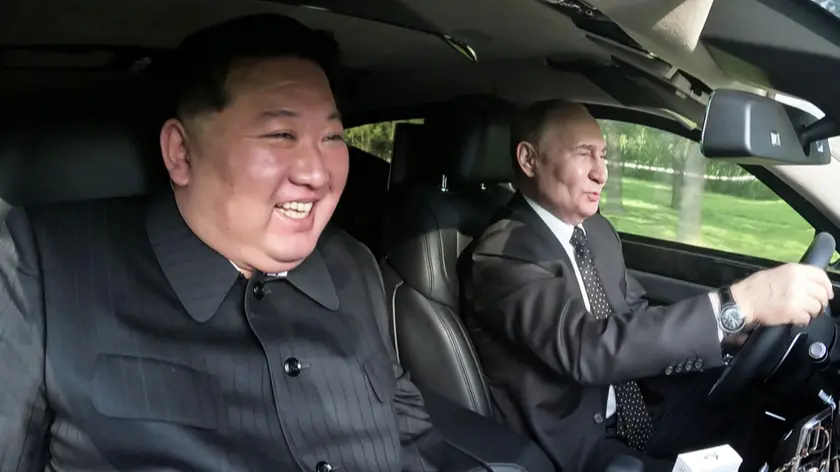 epaselect epa11424309 A photo released by the official North Korean Central News Agency (KCNA) on 20 June 2024, shows Russian President Vladimir Putin driving North Korean leader Kim Jong Un in an Aurus limousine in Pyongyang, North Korea 19 June 2024. The Russian president made a state visit to North Korea on 18-19 June at the invitation of North Korean leader. He last visited North Korea in 2000, shortly after his first inauguration as president. EPA/KCNA EDITORIAL USE ONLY EDITORIAL USE ONLY
