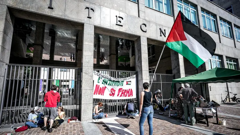 Nine Pro-Palestinian demonstrators chained themselves to the entrance gates of the main headquarters of the Polytechnic University of Turin, in Turin, Italy, 13June 2024. Nine students from the pro-Palestine university collectives chained themselves this morning to the entrance gates of the main headquarters of the Polytechnic of Turin, in Corso Duca degli Abruzzi. ANSA/TINO ROMANO